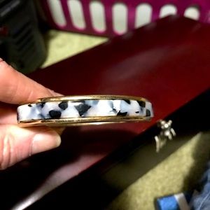 Here is aBangle bracelet gold tan black and silver